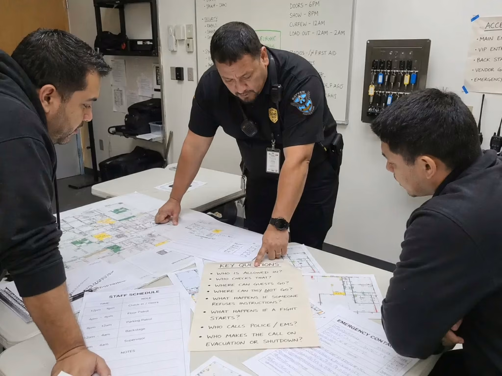 Rayven Security Protection security supervisor reviewing event security plan questions with organizers before an event
