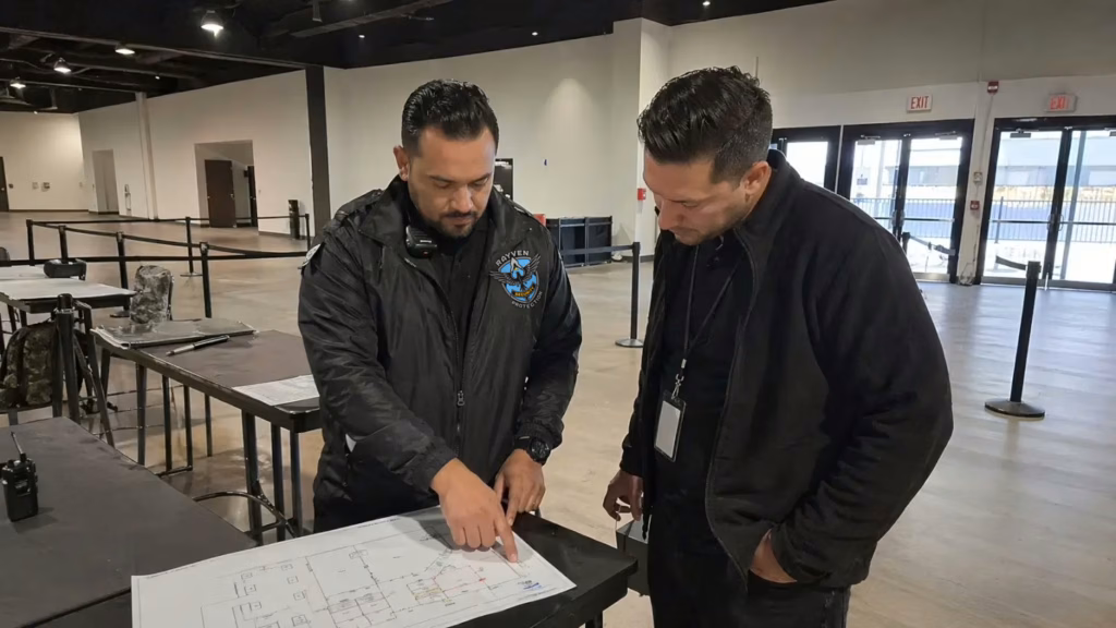 Rayven Security Protection security guard reviewing an event security risk assessment inside a venue before guests arrive